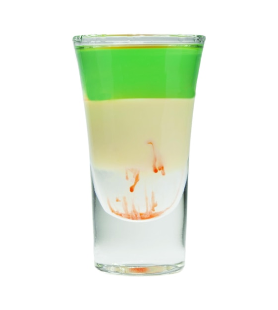 Alcoholic cocktail in shot glass isolated on white