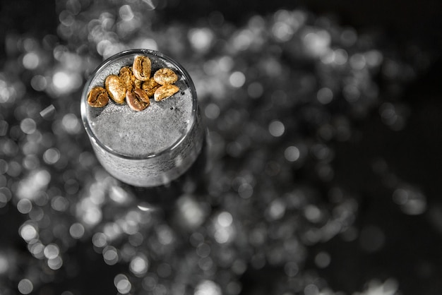 Alcoholic cocktail with beer ice and lemon juice bar tools Low key selective focus