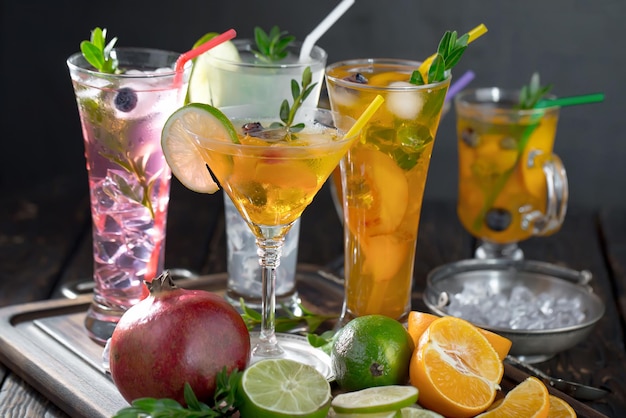 Alcoholic cocktail with fruit and ice