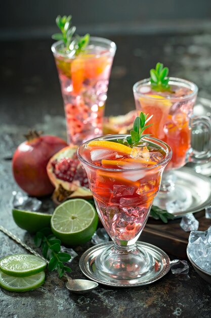Alcoholic cocktail with fruit and ice