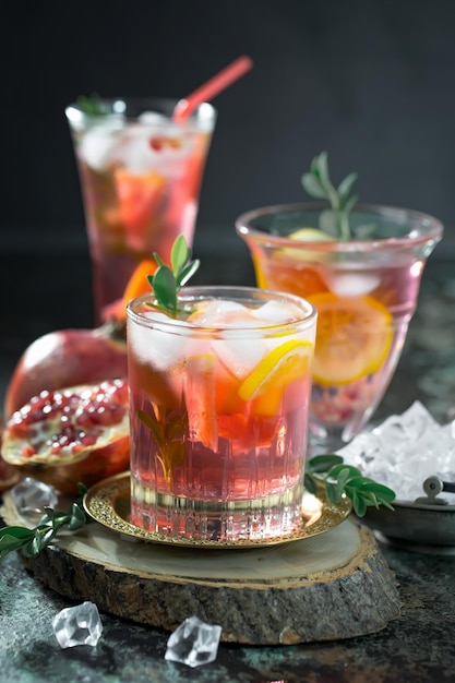 Alcoholic cocktail with fruit and ice