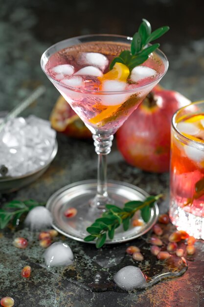 Alcoholic cocktail with fruit and ice