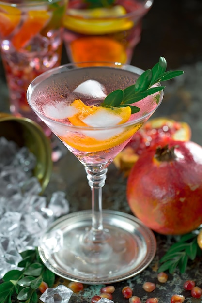 Alcoholic cocktail with fruit and ice