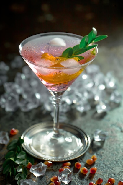 Alcoholic cocktail with fruit and ice