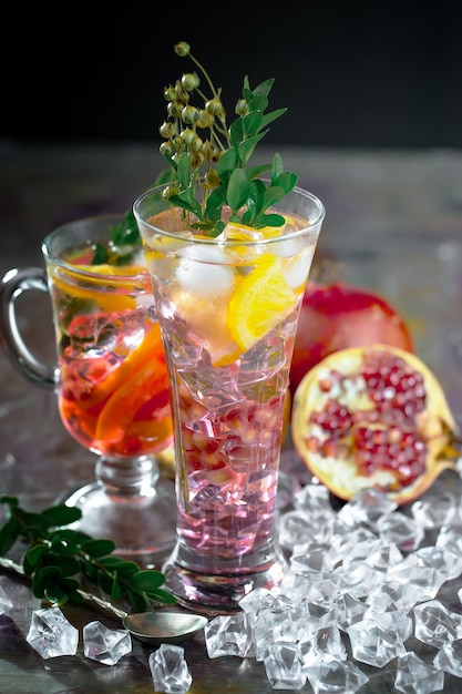 Alcoholic cocktail with fruit and ice