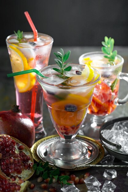 Alcoholic cocktail with fruit and ice