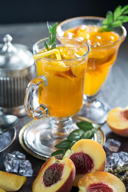 Alcoholic cocktail with fruit and ice