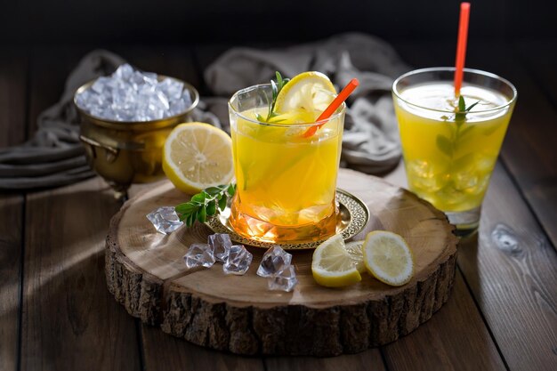 Alcoholic cocktail with fruit and ice