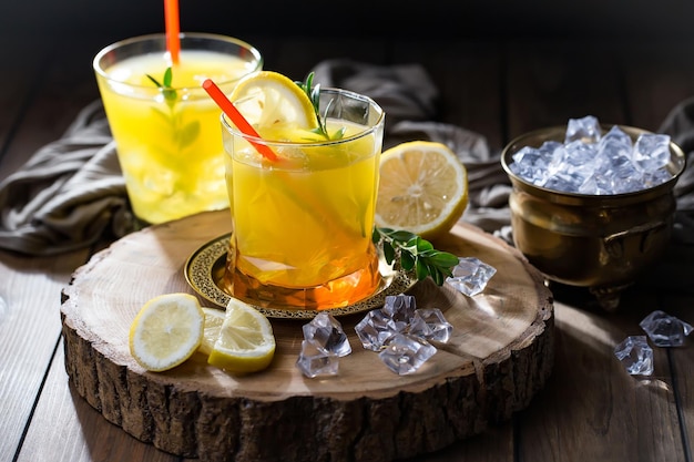 Alcoholic cocktail with fruit and ice