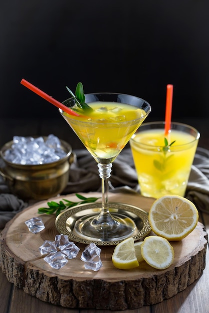 Alcoholic cocktail with fruit and ice