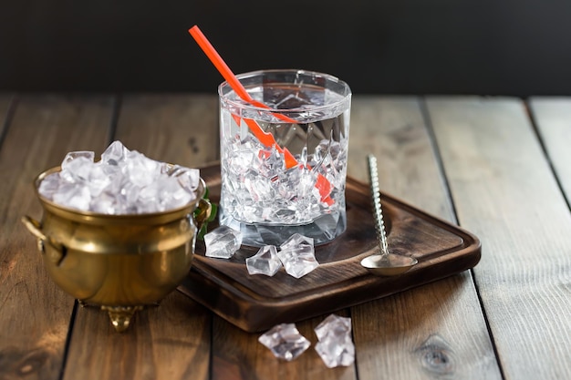 Alcoholic cocktail with fruit and ice