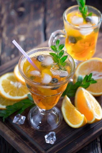 Alcoholic cocktail with fruit and ice