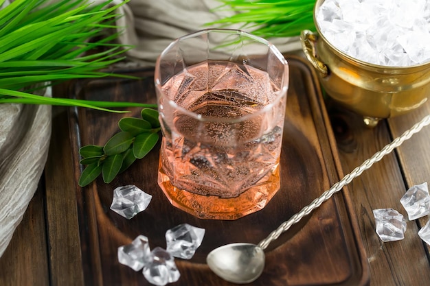 Alcoholic cocktail with fruit and ice