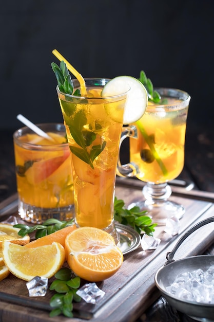 Alcoholic cocktail with fruit and ice