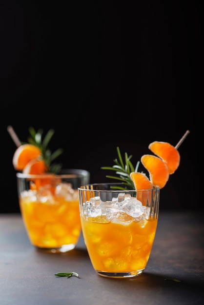 Alcoholic cocktail with mandarins