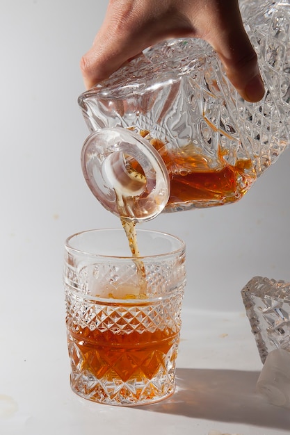 Alcoholic drink in a beautiful old glass and decanter