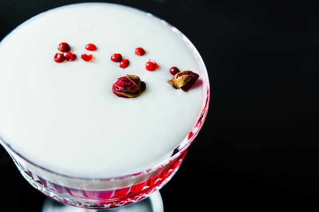 Alcoholic drink A cocktail with elite alcohol on dark black background closeup