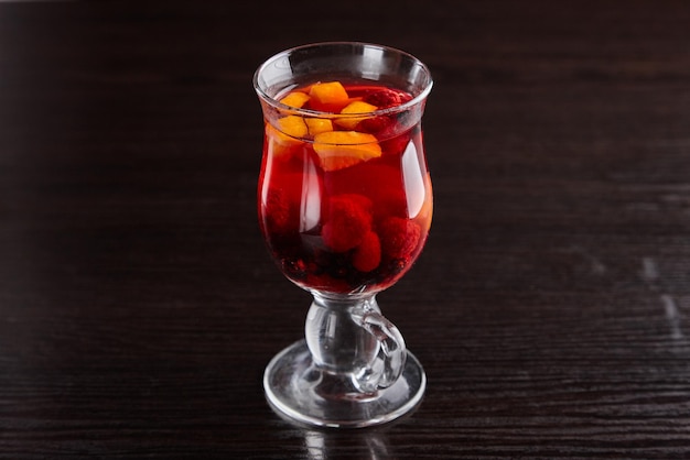 Alcoholic drinks at the bar. Bartender's hands in the process of making drinks.