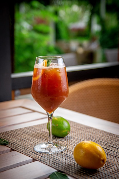 Alcoholic refreshing cocktail coffee ginger ale with tonic on the summer terrace of the restaurant