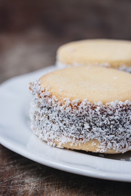 Alfajores cookies on old wood