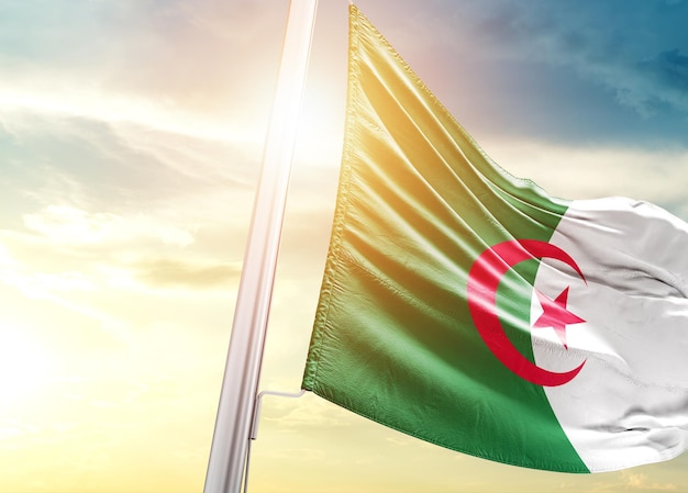 Algeria national flag waving in beautiful sky.