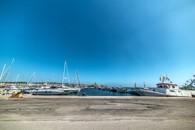 Alghero harbor under a shining sun