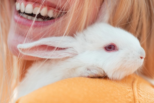 Alice in wonderland rabbit on smile woman mouth background easter bunny