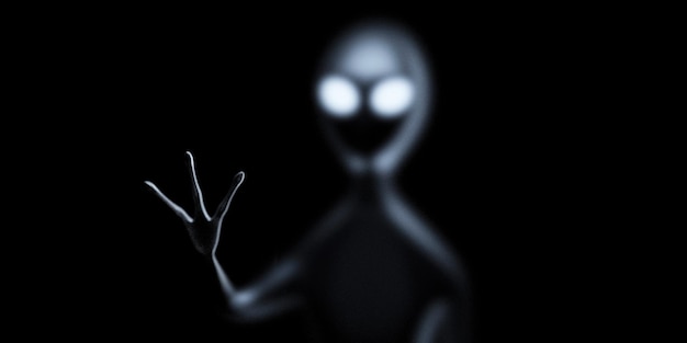 Photo alien stretches his hand on the dark