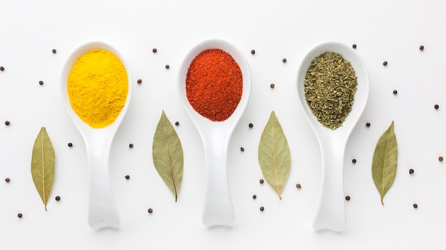 Photo aligned spoons with spicy powder