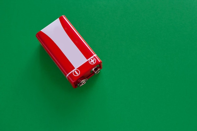 Alkaline Battery used crown on a green background