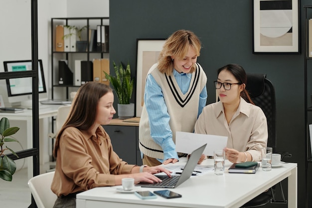 all female business team discussing work plans at meeting in office