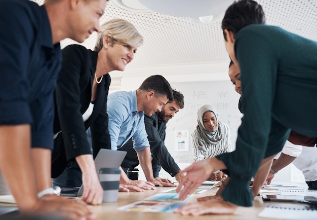 All the input they need to make it work Shot of a group of businesspeople discussing paperwork during a meeting in a modern office