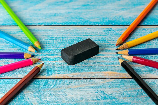 All pencil colorful sharpener on blurred wooden table