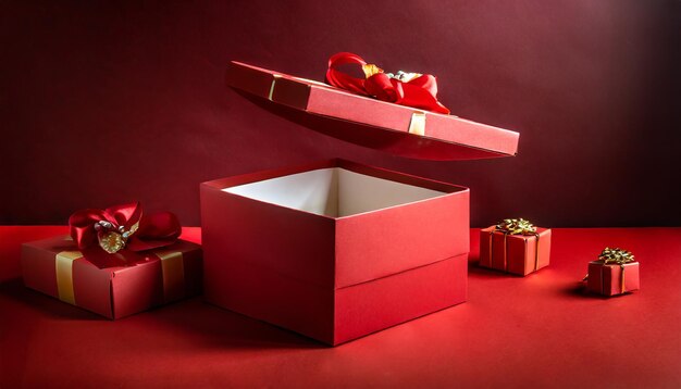 All red gift box concepts blank opening gift box product display showcase isolated on dark red backg..