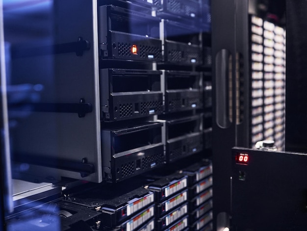 All your data safe and secure Cropped shot of a large dark and empty server room