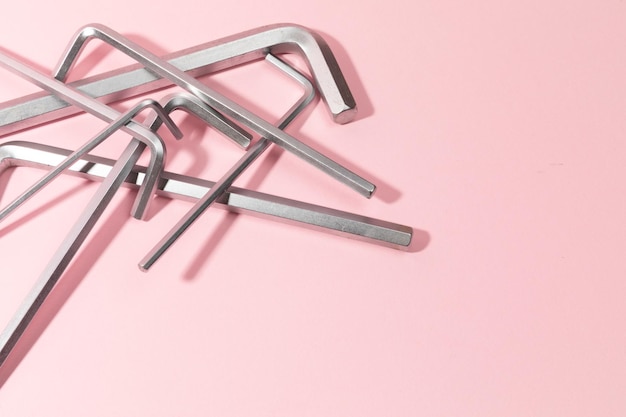 Allen wrenches on pink background