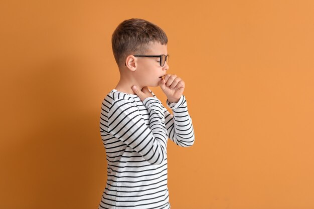 Allergic little boy on color background