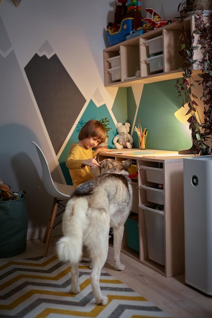 Allergy child pet dog and air purifier in childrens room