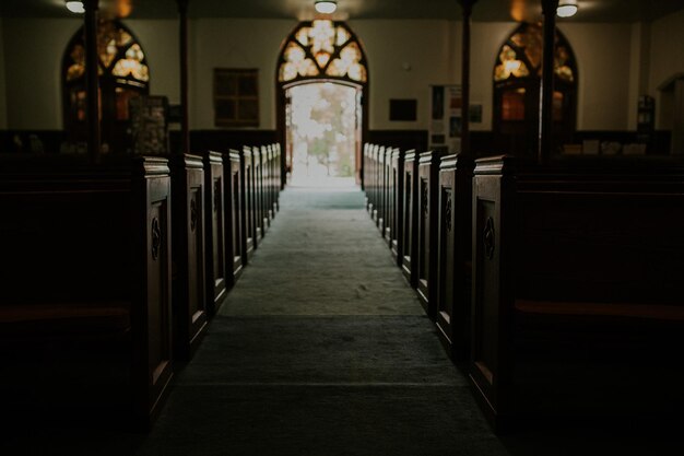 Photo alley amidst benches in church