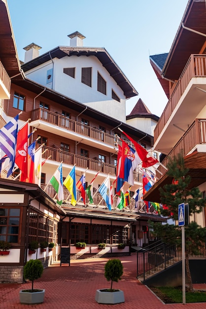 Alley of flags in the Rosa Khutor resort Mountain Olympic village in the Caucasus Mountains