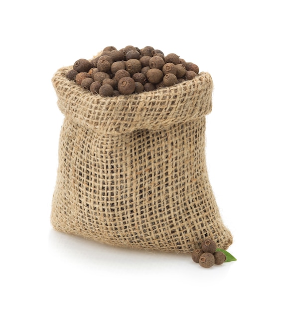 Allspice in bag isolated on white