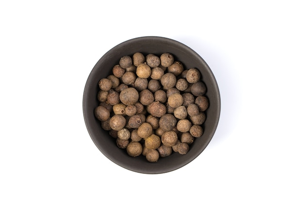 Allspice in a brown bowl