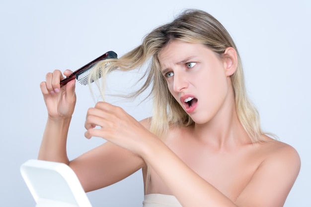 Alluring portrait of woman with cosmetic skin having hair problem