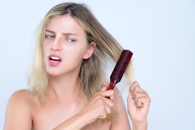 Alluring portrait of woman with cosmetic skin having hair problem