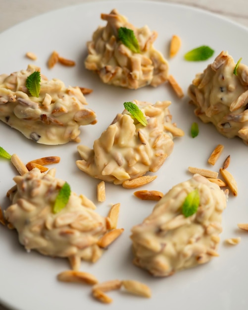 Almond bonbons with white chocolate Toasted flaked almonds covered with white chocolate