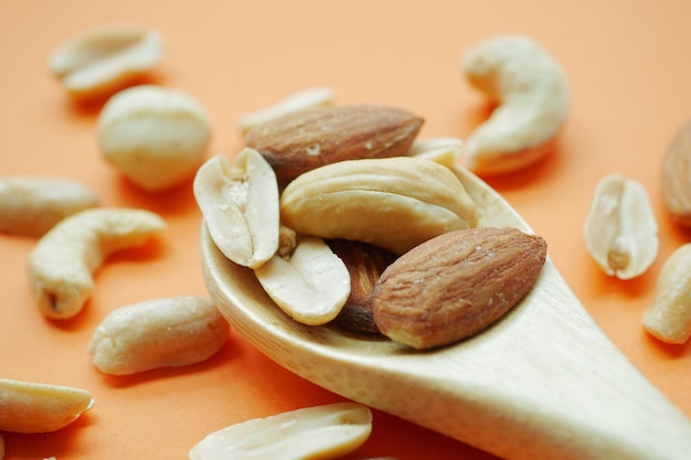 Almond and cashew nuts on wooden spoon