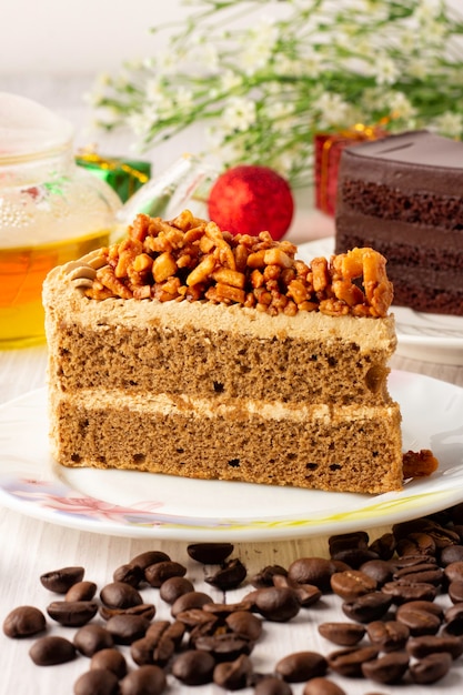 Almond coffee cake on a white plate, triangular cake