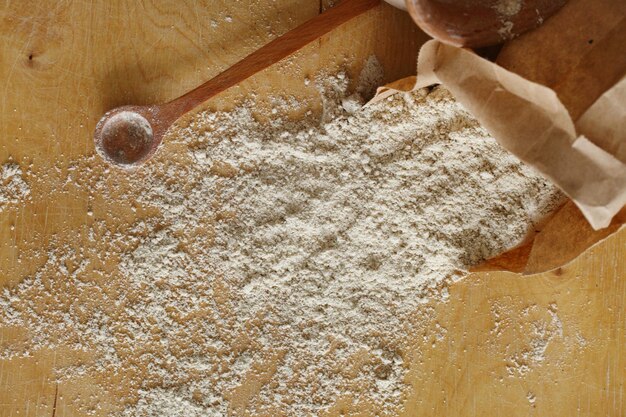 Almond flour pile from top on wooden background