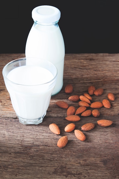 Almond milk in glass and bottle