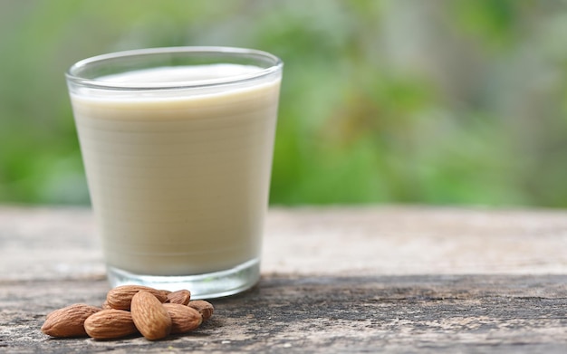 Almond milk on wooden background